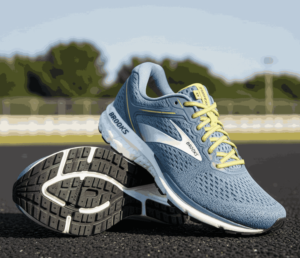 Light blue Brooks running shoes with white logo and yellow laces on outdoor track